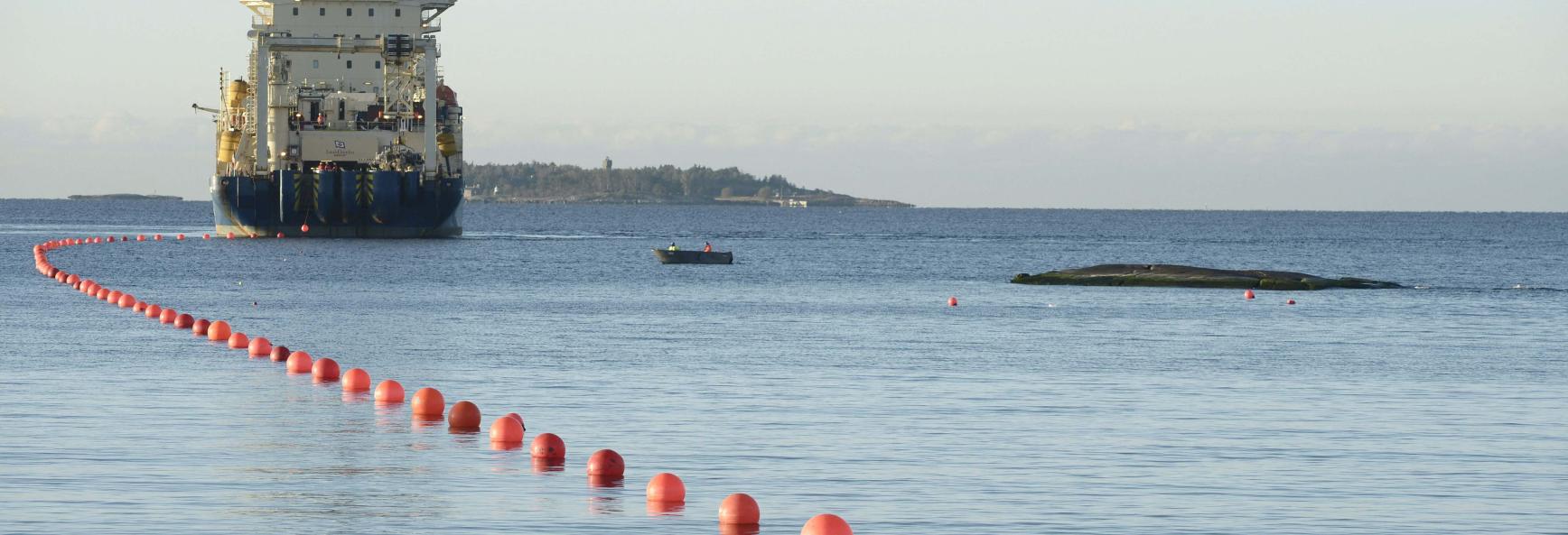 This picture taken on October 12, 2015 shows the C-Lion1 submarine telecommunications cable being laid to the bottom of the Baltic Sea by cable laying ship 'Ile de Brehat' off the shore of Helsinki, Finland