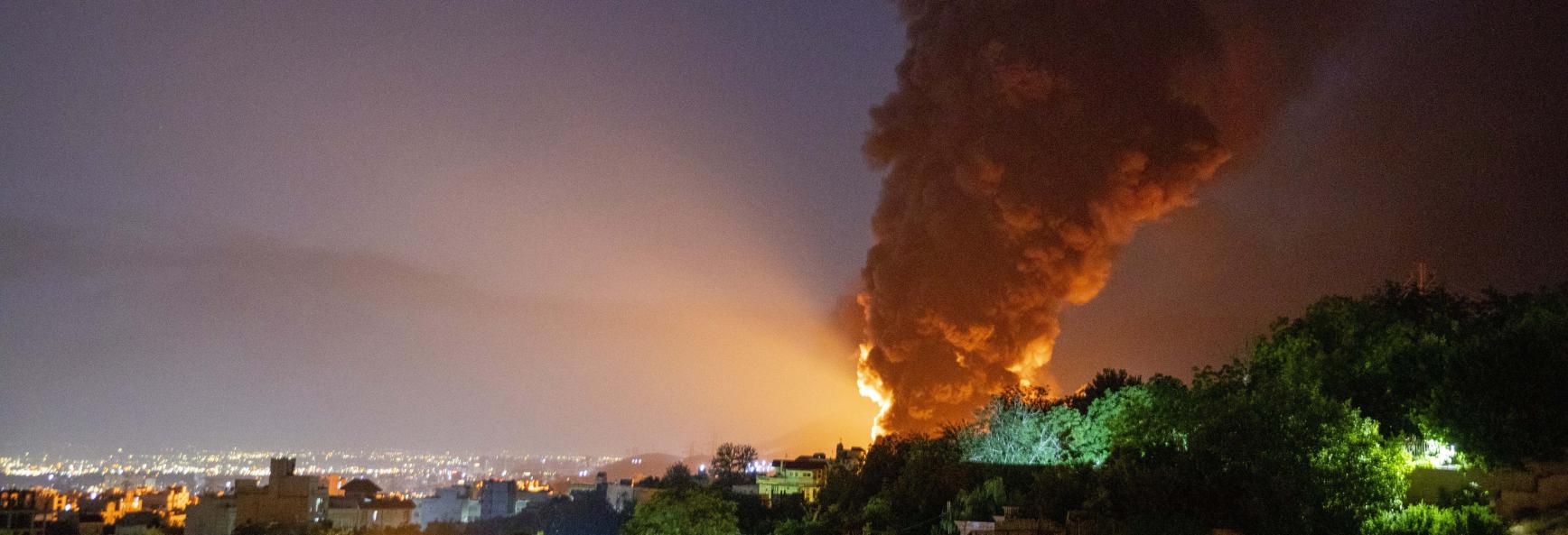 Fire and smoke rise into the sky after an Israeli attack on the Shahran oil depot on June 15, 2025 in Tehran, Iran.